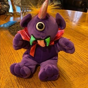 Singing purple people eater plush